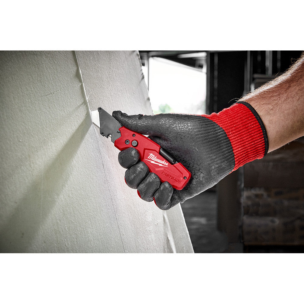 Milwaukee 48-22-1505 FASTBACK 6-In-1 Folding Utility Knife showing in use cutting sheet of drywall
