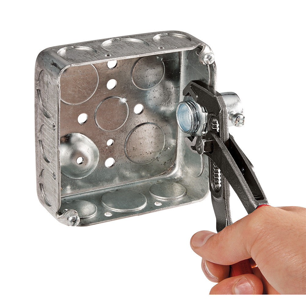 Milwaukee 48-22-6212 12 inch Comfort Grip V-Jaw Pliers showing in use holding electrical box connector