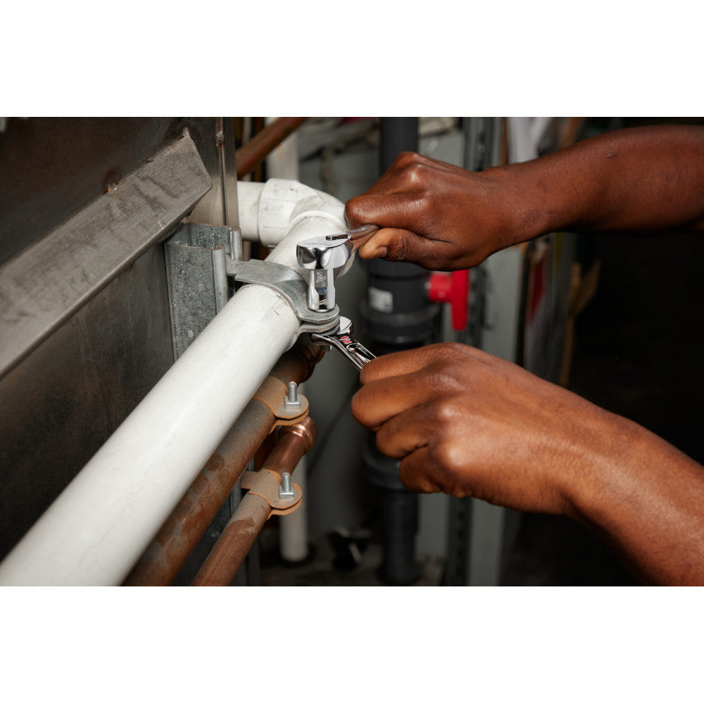 Milwaukee 48-22-9415 15pc SAE Combination Wrench Set showing in use fastening bracket around a pipe