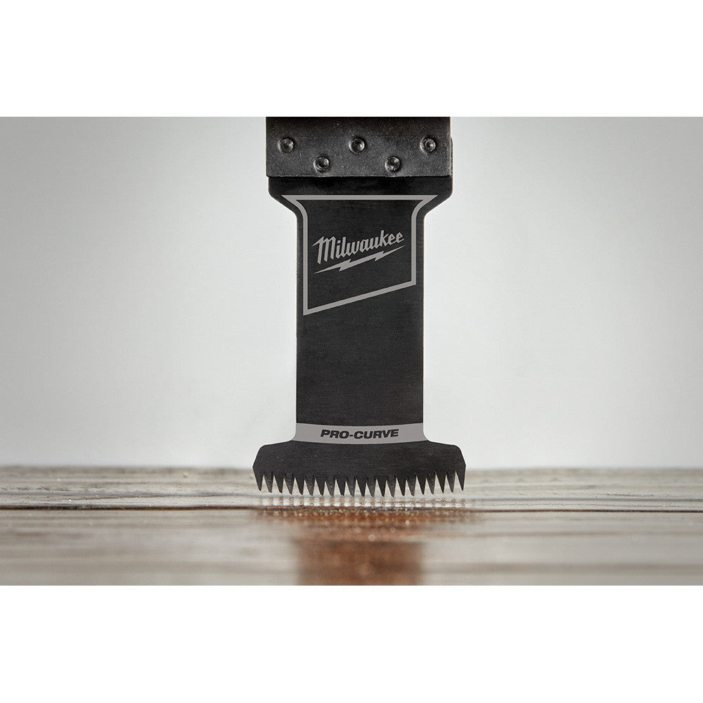 Milwaukee 49-25-1131 OPEN-LOK 1-3/8-inch Universal Fit HCS Japanese Teeth Hardwood Cutting Multi-Tool Oscillating Blade showing in use plunge cutting into laminate flooring
