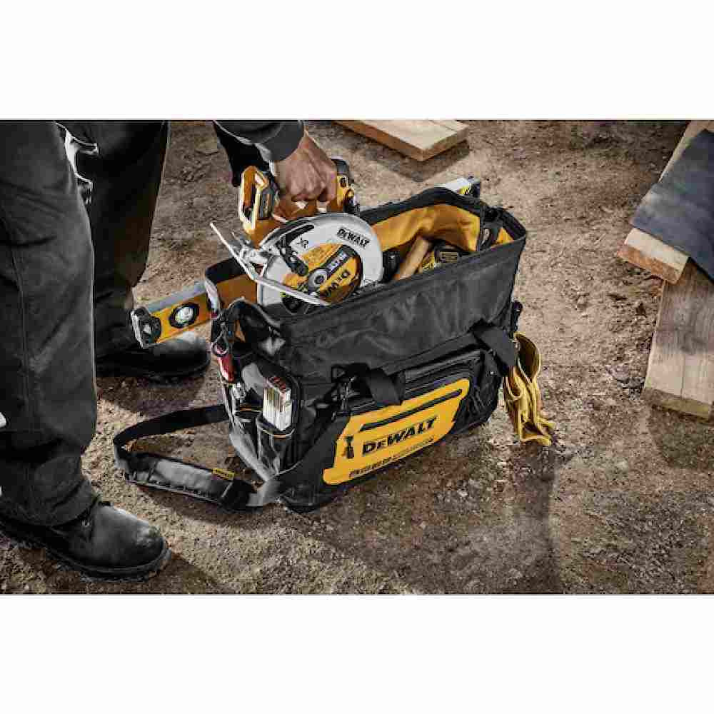 DeWalt DWST560104 20 inch Professional Open Mouth Tool Bag showing with tools loaded in bag on jobsite (Tools sold separately)