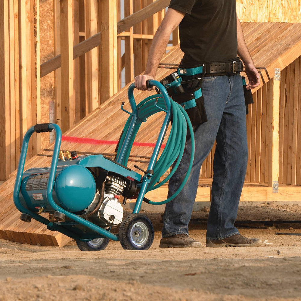 Makita MAC5200 13.8 Amp 3 HP Big Bore 5.2 Gallon Air Compressor showing compressor being moved around on the job site