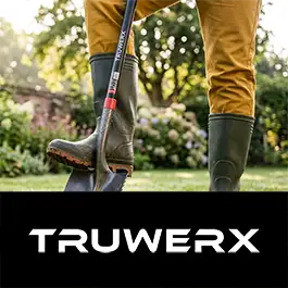 Person wearing green boots with a tool, standing on grass with 'TRUWERX' branding