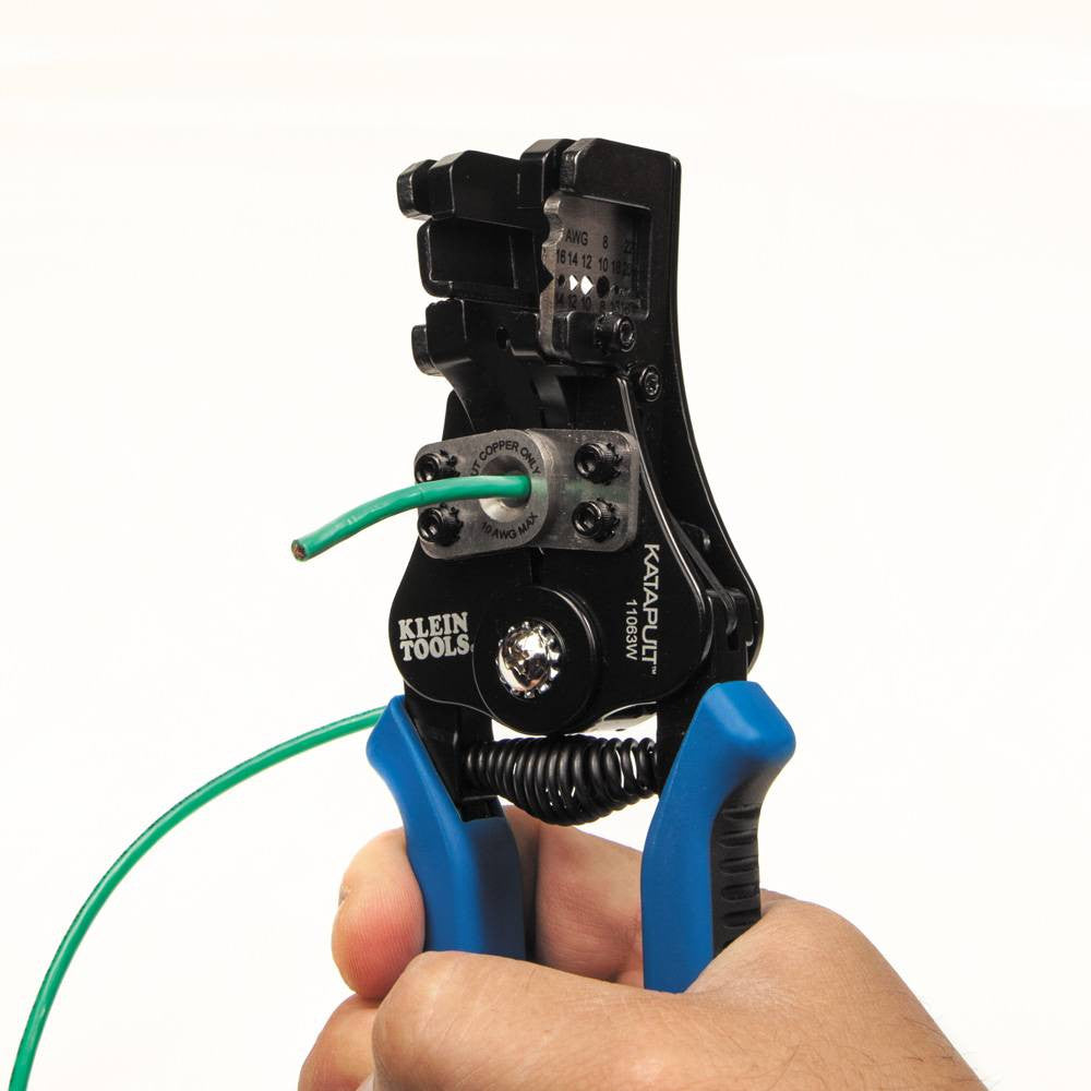 Klein Tools 11063W 8-22 AWG Solid & Stranded Katapult Wire Stripper & Cutter showing in use stripping electrical cable through center hole