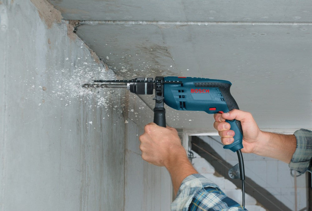 Bosch 1191VSRK 7 Amp 1/2 inch Variable Speed Hammer Drill showing in use drilling horizontally into a concrete