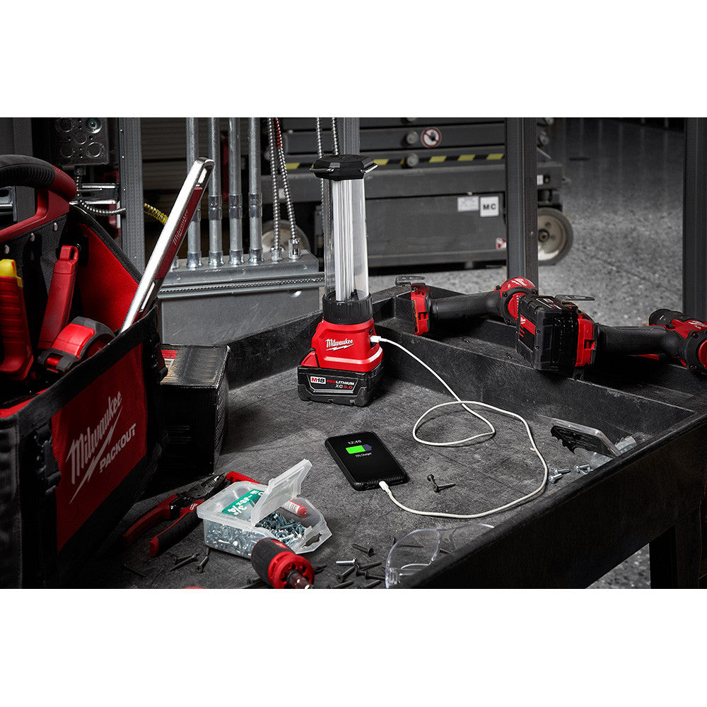 Milwaukee 2363-20 M18 Work Lantern / Trouble Light with USB Charging illuminating a work area (battery sold separately)