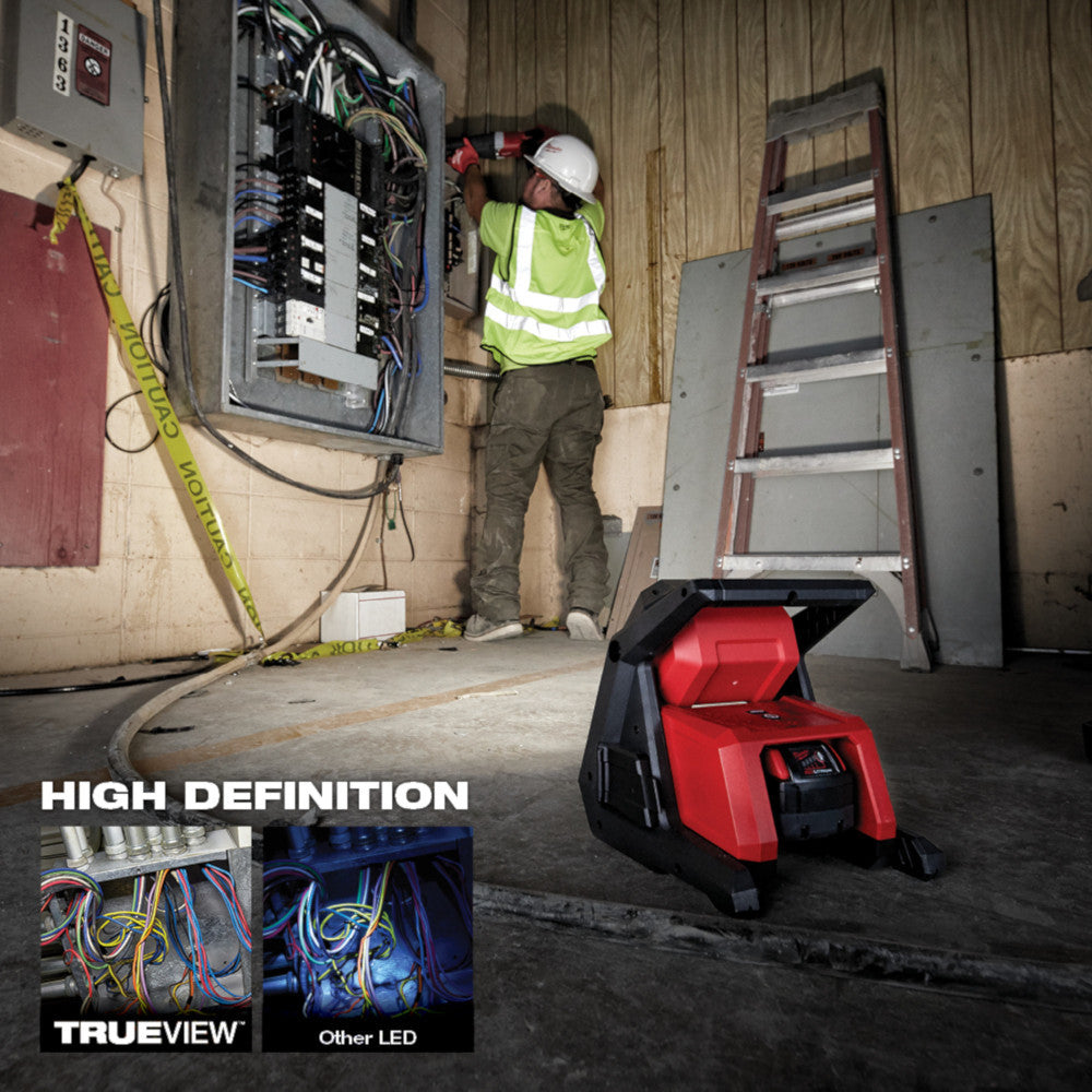 Milwaukee 2366-20 M18 ROVER 4000 Lumen Dual-Power Flood Light illuminating a work area (extension cord not included)