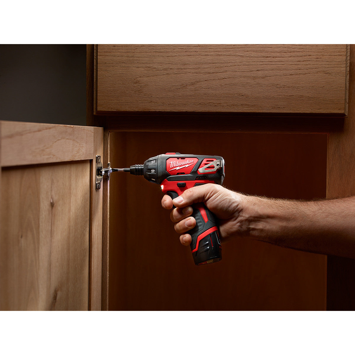 Milwaukee 2401-20 M12 1/4 inch Hex Screwdriver installing a hinge (battery and bits sold separately)
