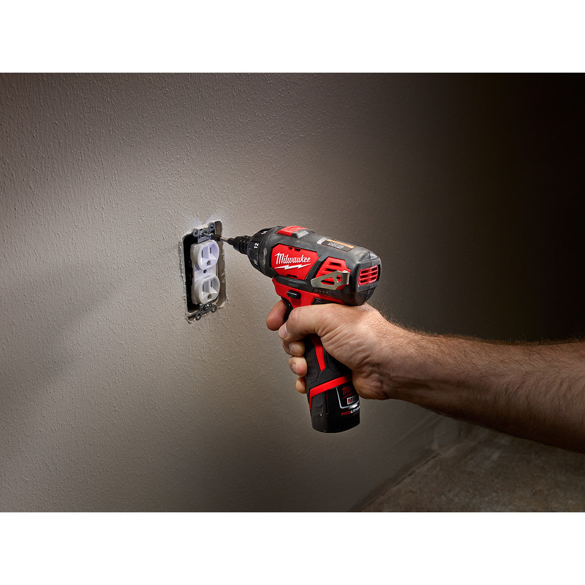Milwaukee 2401-22 M12 1/4 inch Hex Screwdriver installing an electrical outlet