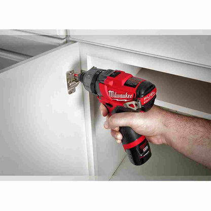 Milwaukee 2402-22 M12 FUEL Cordless Brushless 1/4 inch Hex 2-Speed Screwdriver Kit showing fastening hinge to cabinet door