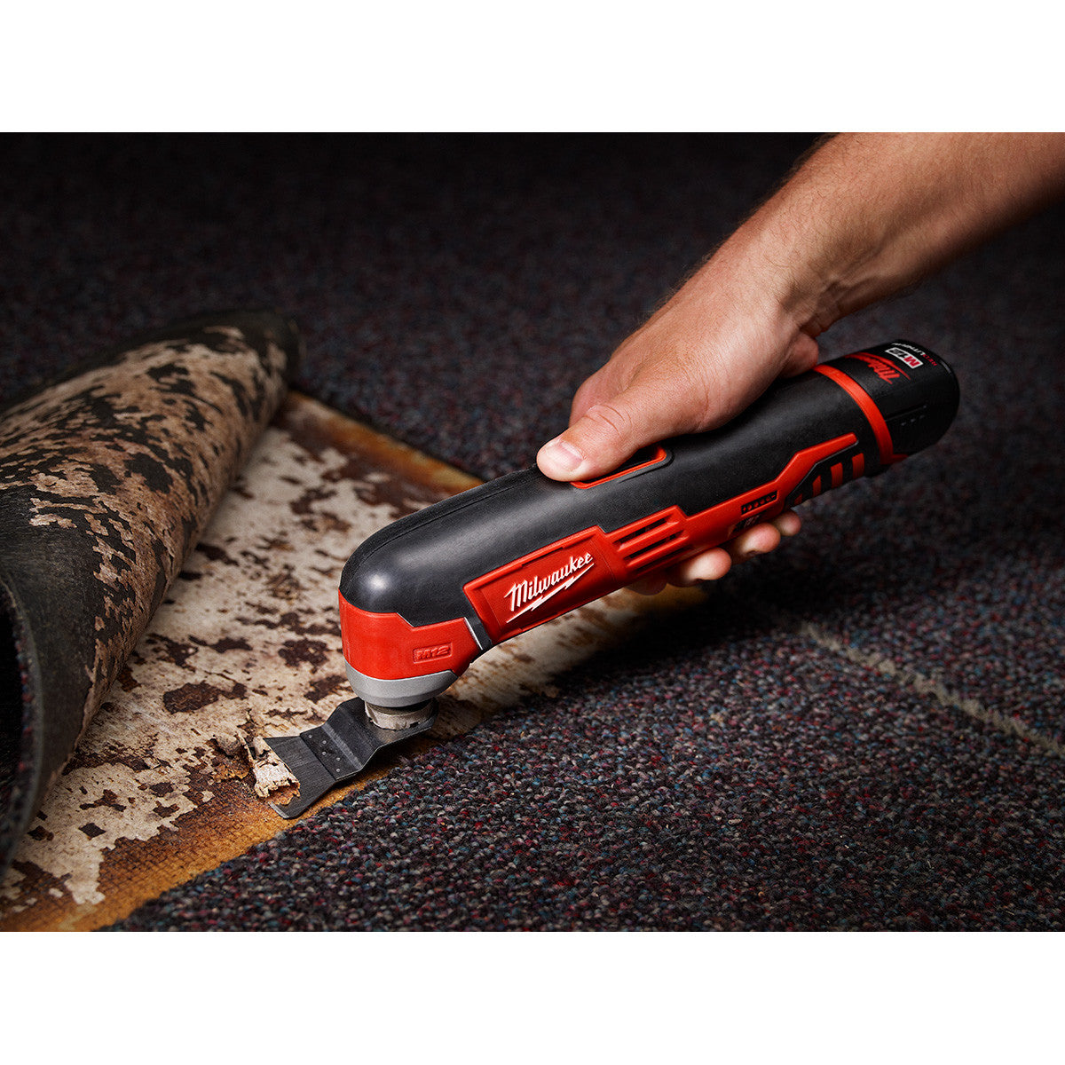 Milwaukee 2426-20 M12 Multi-Tool stripping carpet from floor (battery sold separately)