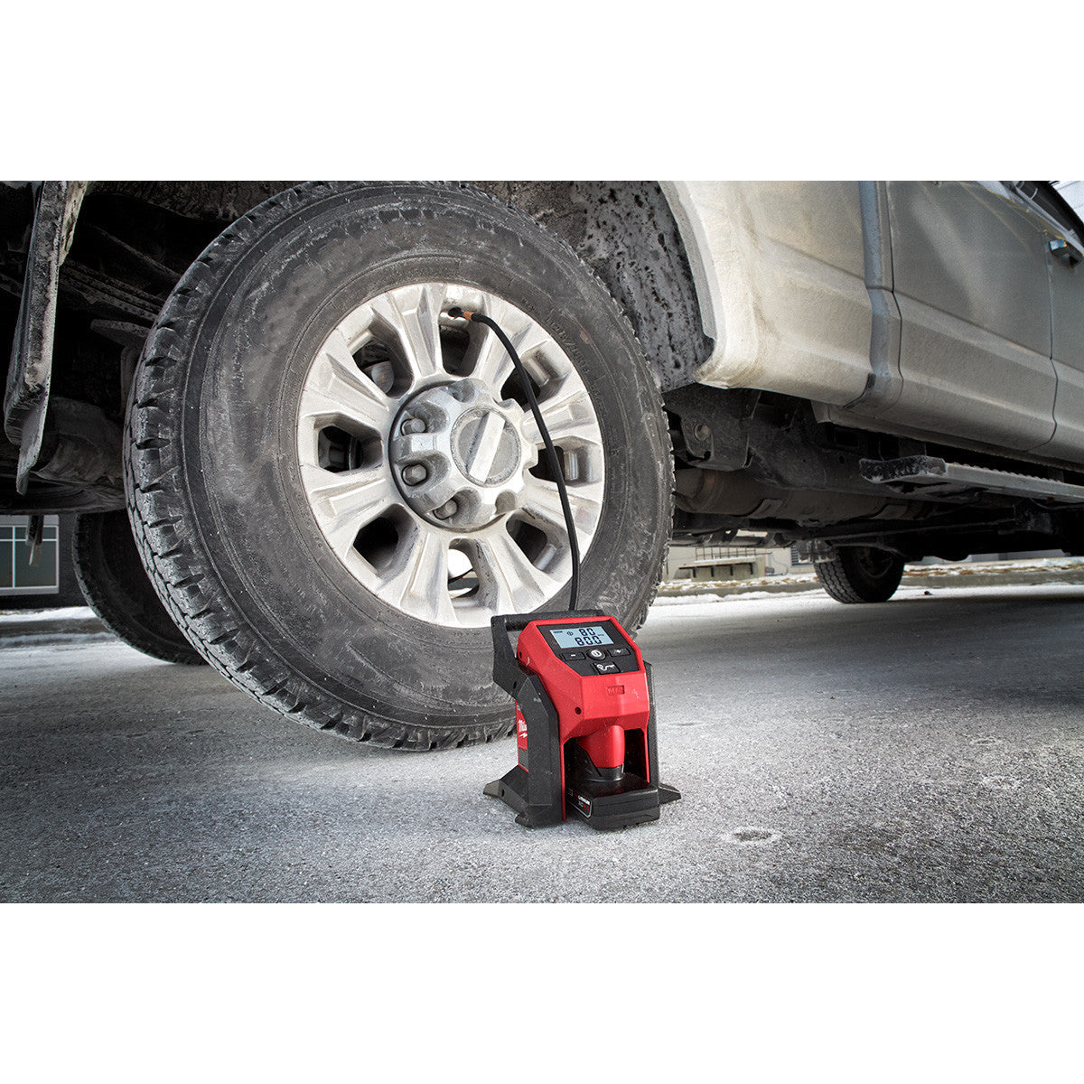 Milwaukee 2475-20 M12 Compact Air Inflator inflating an LT truck tire (battery sold separately)