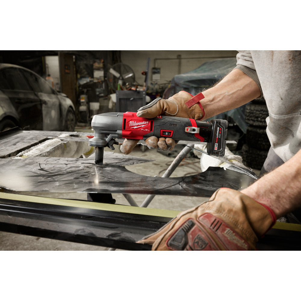 Milwaukee 2476-20 M12 FUEL Cordless 16 Gauge Variable Speed Nibbler (Tool Only)  showing nibbler in use cutting sheet metal