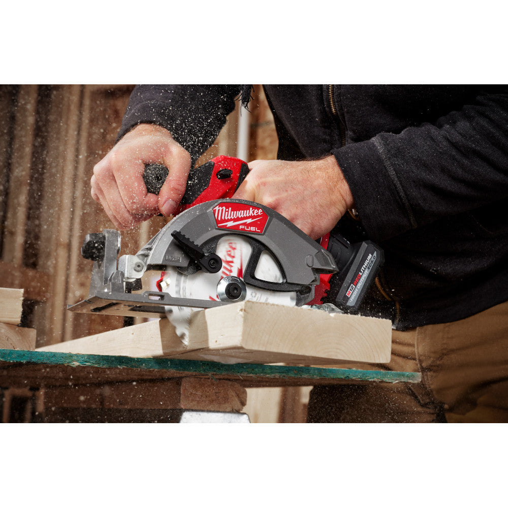 Milwaukee 2521-20 12V FUEL 5-3/8in Circular Saw (Tool Only) showing in use cutting through wood stud (Battery Sold Separately)