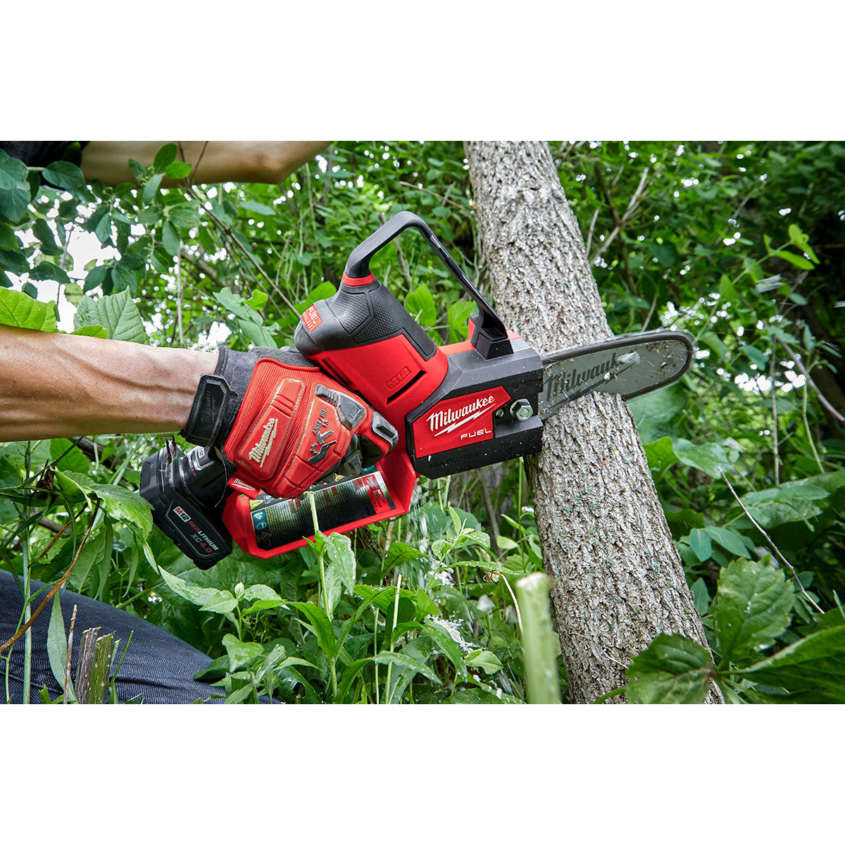 Milwaukee 2527-20 M12 FUEL Brushless HATCHET 6 inch Pruning Saw cutting  a large tree branch (battery sold separately)