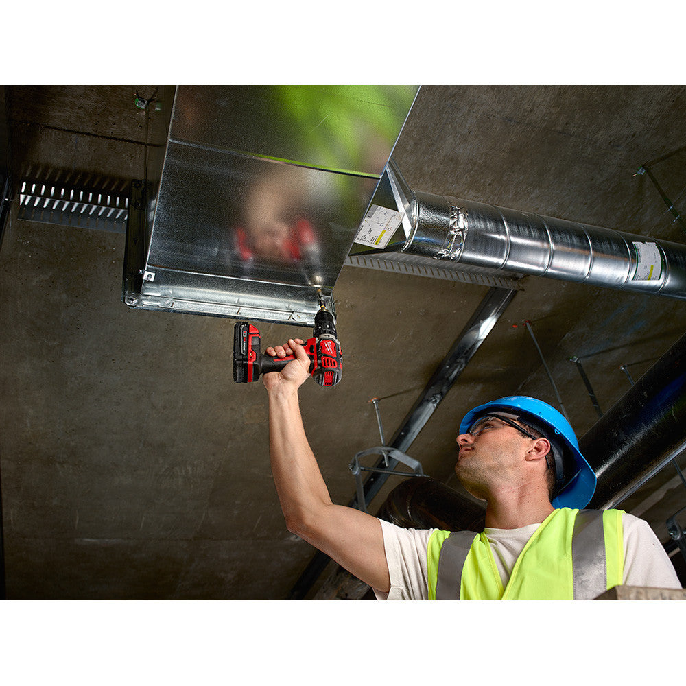 Milwaukee 2607-20 M18 Compact 1/2-Inch Hammer Drill/Driver drilling into ceiling (battery sold separately)