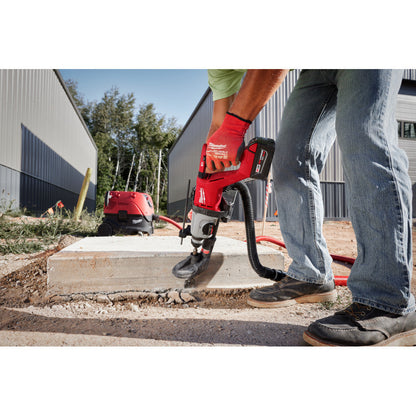 Milwaukee 2613-20 M18 Cordless Brushless 1 inch SDS Plus D-Handle Rotary Hammer (Tool Only) showing in use drilling downward through a concrete slab