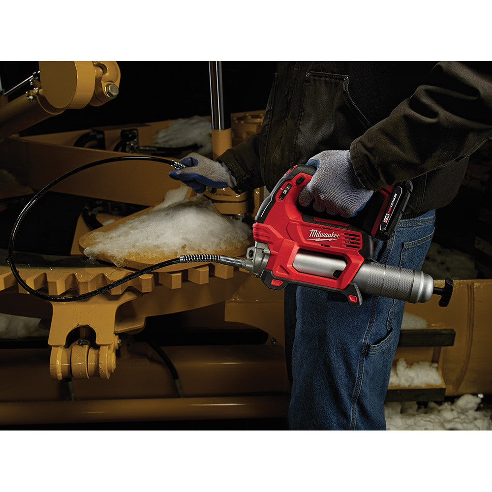 Milwaukee 2646-20 M18 2-Speed Grease Gun dispensing grease onto equipment (battery sold separately)