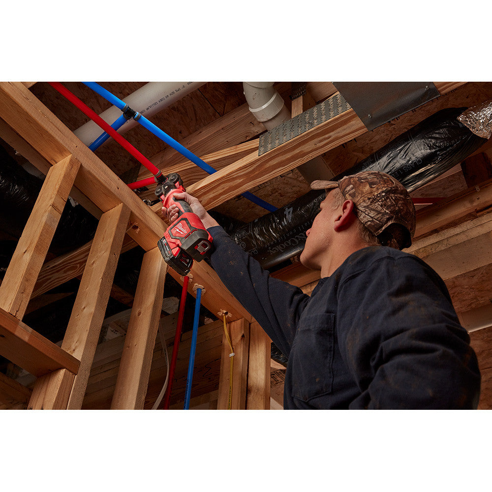Milwaukee 2674-22C M18 Cordless Short Throw Press Tool Kit with PEX Crimp Jaws showing in use crimping water lines in the ceiling