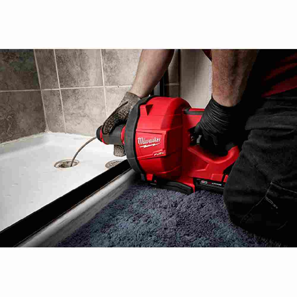 Milwaukee 2772A-21 M18 FUEL Cordless Drain Cleaning Snake Auger with CABLE DRIVE Kit showing in use clearing a shower drain