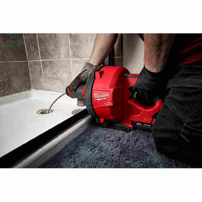 Milwaukee 2772A-21 M18 FUEL Cordless Drain Cleaning Snake Auger with CABLE DRIVE Kit showing in use clearing a shower drain