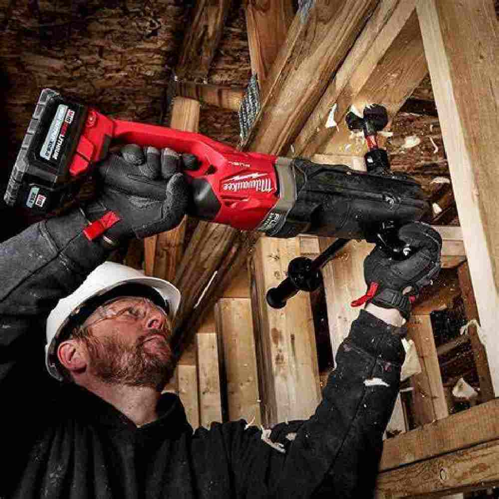 Milwaukee 2811-20 M18 FUEL SUPER HAWG Cordless Brushless Right Angle Drill (Tool Only) showing in use drilling upward vertically through wood plating