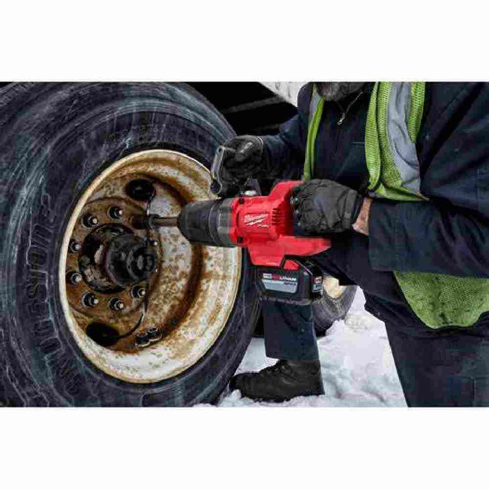 Milwaukee 2869-22HD M18 FUEL Cordless Brushless D-Handle Extended Anvil High Torque 1 inch Impact Wrench Kit showing in use fastening a lug nut on heavy equipment