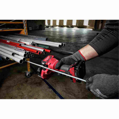 Milwaukee 2872-20 M18 Cordless Brushless Threaded Rod Cutter (Tool Only) showing in use cutting threaded rod from stock pile