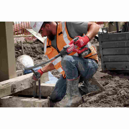 Milwaukee 2911-20 M18 FUEL Cordless 8 foot Concrete Pencil Vibrator (Tool Only) showing in use working with concrete footings