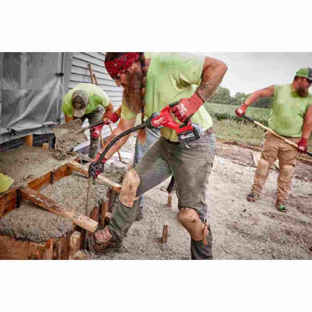 Milwaukee 2911-20 M18 FUEL Cordless 8 foot Concrete Pencil Vibrator (Tool Only) showing in use working with concrete stairs/ steps