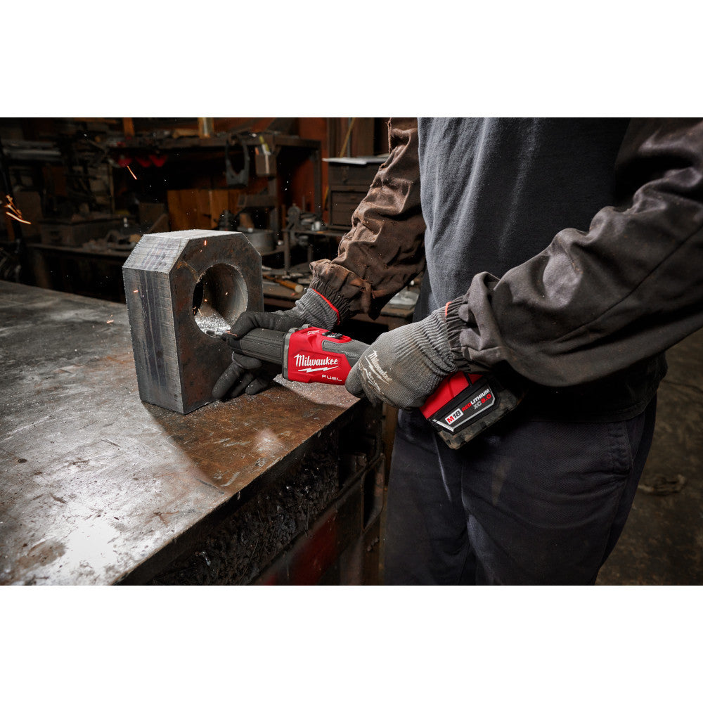 Milwaukee 2939-20 M18 FUEL Cordless Brushless Braking Die Grinder with Slide Switch (Tool Only) showing in use grinding out the inside of large metal pipe bracket