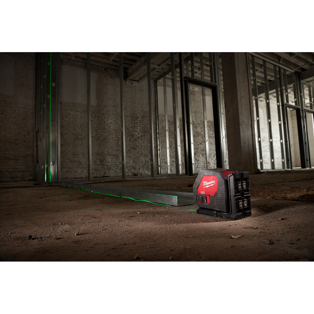 Milwaukee 3421 Green Cross Line Laser showing in use to ensure accurate plumb level of steel studs