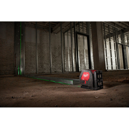 Milwaukee 3421 Green Cross Line Laser showing in use to ensure accurate plumb level of steel studs
