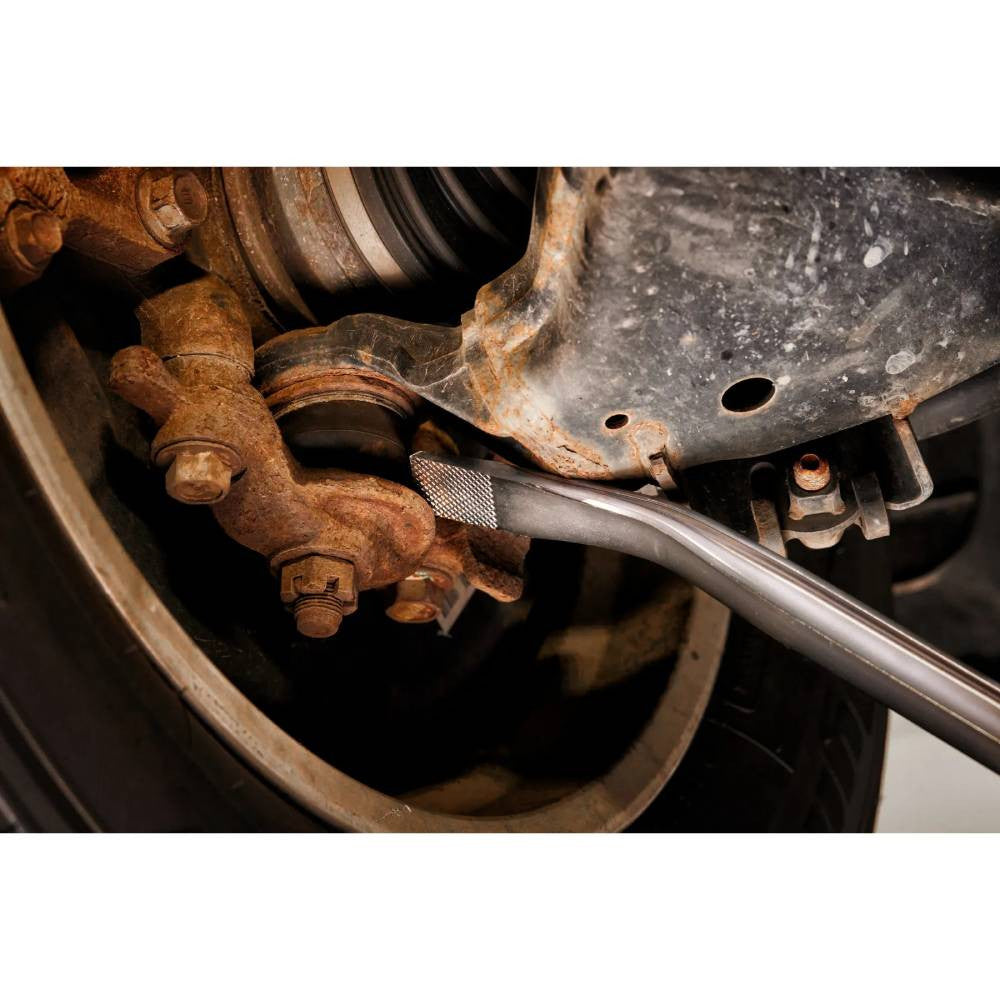 Milwaukee 45-74-9242 42 inch Pry Bar  showing in use separating brackets in vehicle during repair work