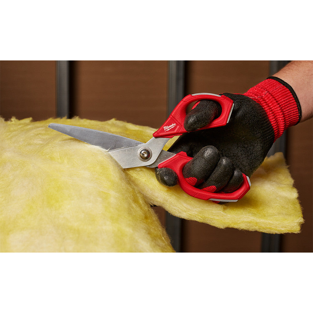 Milwaukee 48-22-4046 Jobsite Straight Scissors showing scissors in cutting fiberglass insulation