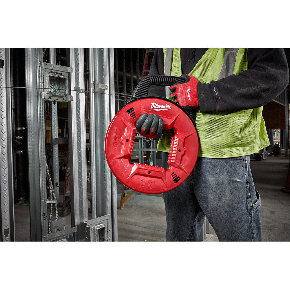 Milwaukee 48-22-4176 120 feet 1/8 inch Steel Fish Tape showing in use feeding fish tape through electrical conduit in steel stud wall