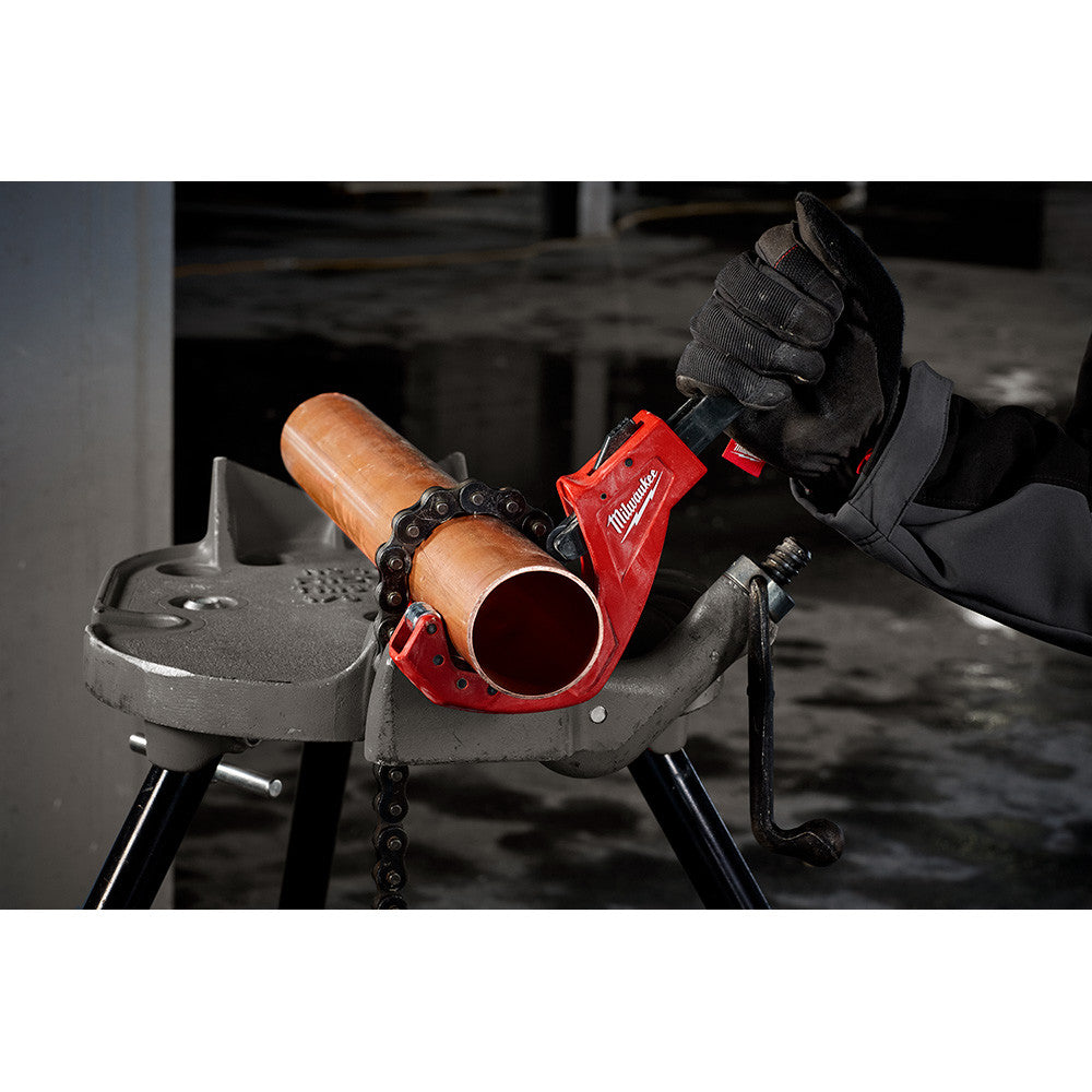 Milwaukee 48-22-4253 2-1/2 inch Quick Adjust Copper Tubing Cutter showing in use cutting pipe while being mounted to stand