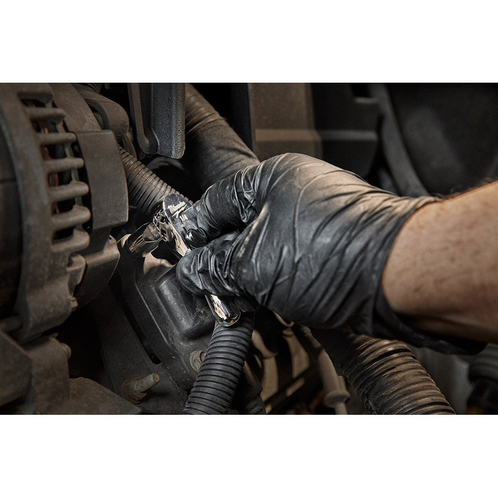 Milwaukee 48-22-9003 1/4-inch Drive 3-inch Stubby Ratchet showing in use fastening bolt in confined space inside motor cavity