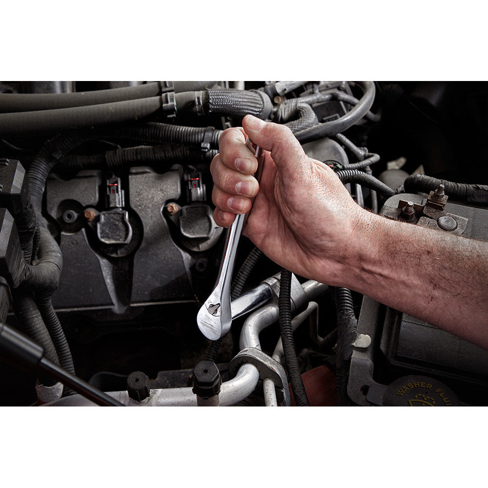 Milwaukee 48-22-9508 32pc Metric 3/8-inch Drive Ratchet & Socket Set showing in use fastening bolt inside motor cavity