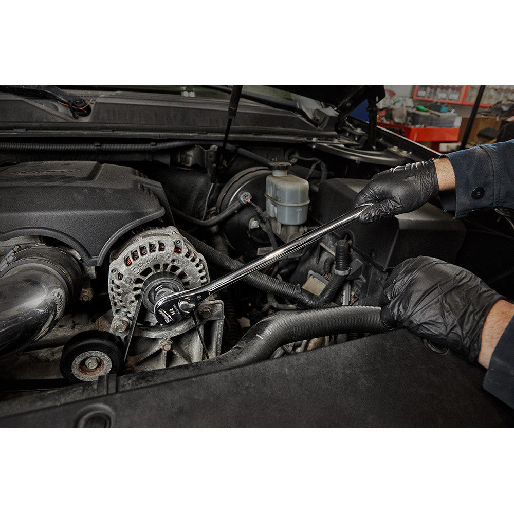 Milwaukee 48-22-9050 1/2-inch Drive 18-inch Extended Ratchet showing in use fastening bolt inside motor cavity