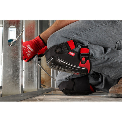 Milwaukee 48-73-6030 Performance Hard Shell Knee Pads showing in use being worn by you while installing steel studs