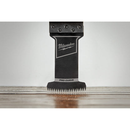 Milwaukee 49-25-1131 OPEN-LOK 1-3/8-inch Universal Fit HCS Japanese Teeth Hardwood Cutting Multi-Tool Oscillating Blade showing in use plunge cutting into laminate flooring
