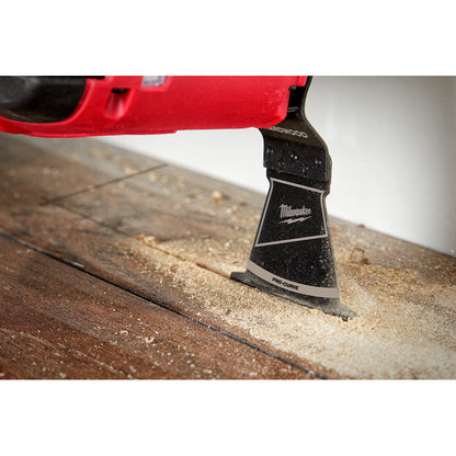 Milwaukee 49-25-1153 OPEN-LOK 2-1/2-inch Universal Fit HCS Japanese Teeth Hardwood Cutting Multi-Tool Oscillating Blades - 3pk showing in use plunge cutting into laminate flooring