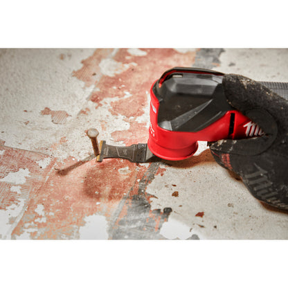 Milwaukee 49-25-1503 OPEN-LOK 1-3/8-inch Universal Fit Titanium Enhanced Carbide Teeth Metal Cutting Multi-Tool Oscillating Blades - 3pk showing in use cutting nail sticking out of a sub floor