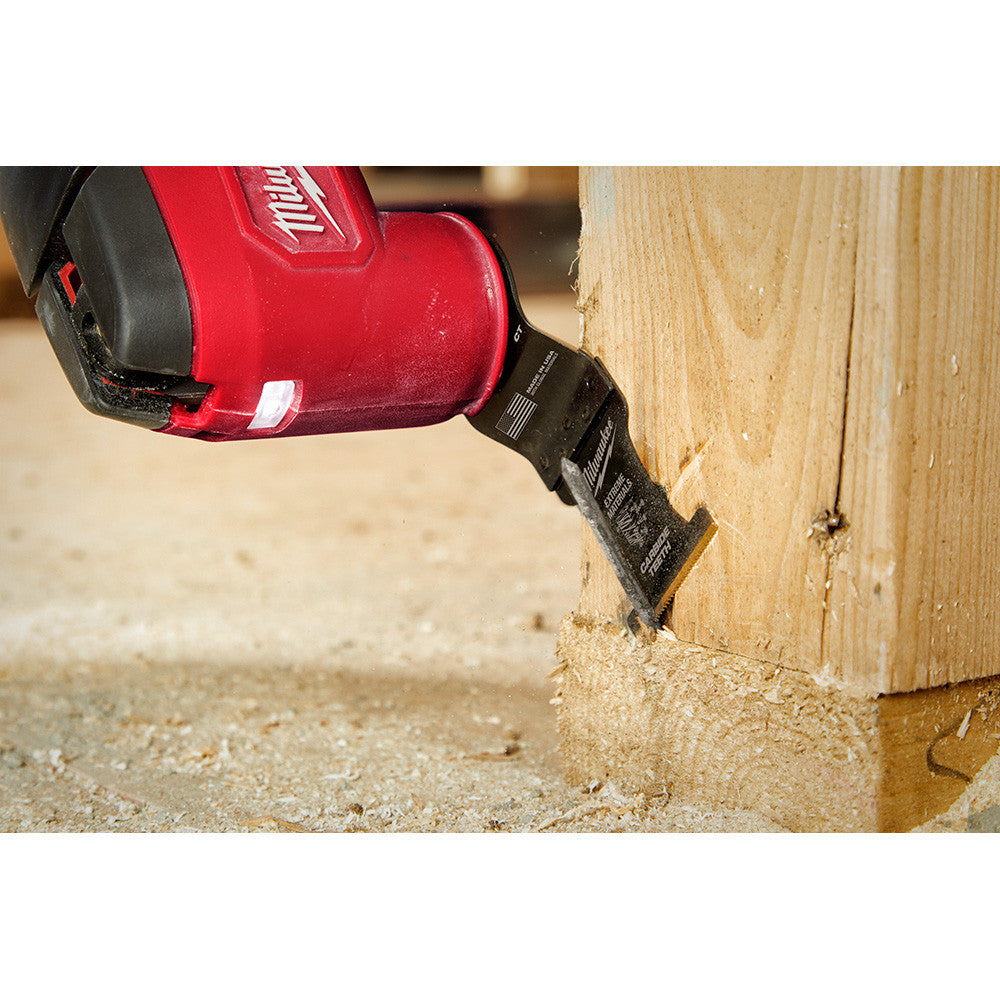 Milwaukee 49-25-1523 OPEN-LOK 1-3/8-inch Universal Fit Titanium Enhanced Carbide Teeth Multi-Material Cutting Multi-Tool Oscillating Blades - 3pk showing in use cutting nail sticking out of a  2 inchX4 inch wood stud