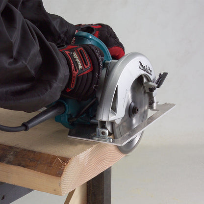 Makita 5007NB 15 Amp 7-1/4 inch Circular Saw showing in use cutting through dimensional lumber