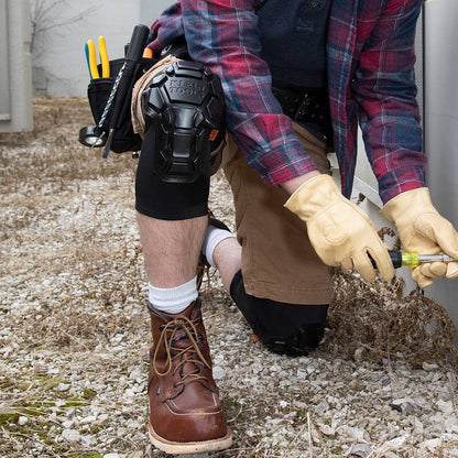Klein Tools 60511 Heavy Duty Knee Pad Sleeves - M/L showing being worn and kneeling on gravel while working