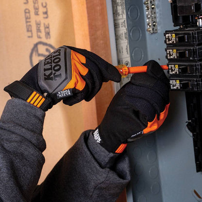 Klein Tools 60596 General-Purpose Utility Gloves - Large showing in use while attaching to an electrical breaker