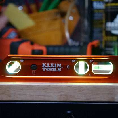 Klein Tools 935RBLT 9-inch Aluminum Rare-Earth Magnet Lighted Torpedo Billet Level showing level with the integrated lights tuned on