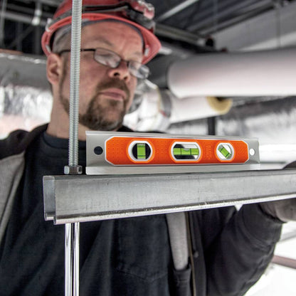 Klein Tools 935R 9-inch Aluminum Rare-Earth Magnet Torpedo Billet Level showing in use levelling a bracket hung by ready-rod